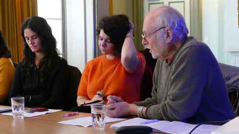 Professor Walter Mignolo talking with postgraduate students during his masterclass in Old Government House.