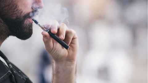 A man 'smokes' a vape device: The recent cluster of US vapers with serious acute lung disease is most likely to have been caused by something in the e-cigarettes liquid they were vaping. Photo iStock