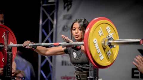 Shehnaz Hussain preparing to lift weights