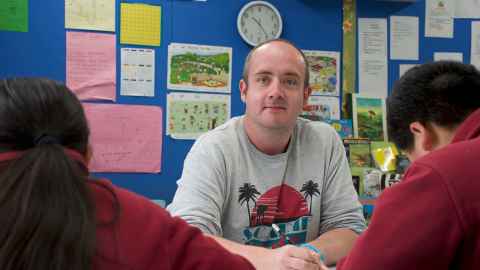 Duncan Preston at the front of a classroom
