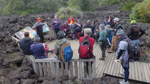 Enthusiasm eruption: Bruce Hayward talks to school science teachers from New Zealand, Australia and the United States on Rangitoto Island.