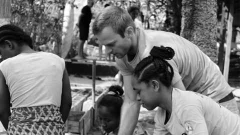 Sam Lucas on the ground helping educate Malagasy students in Mahanoro.