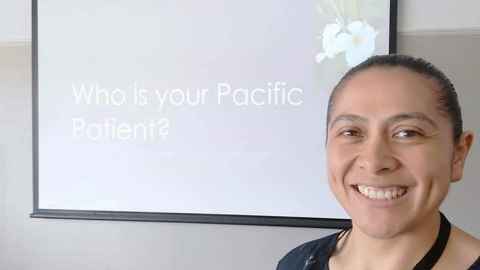 Natalia Nu’u standing next to a screen displaying the text "Who is your Pacific Patient?"