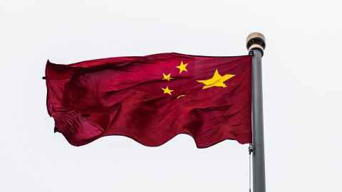 Chinese flag flying on a flagpole