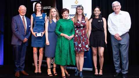 Sir Richard Faull, Dr Emma Scotter, Kerry Walker, Governor General Dame Patsy Reddy, Dr Christina Buchanan, Chitra Vinnakota, Professor Mike Dragunow standing in front of a banner with the logo of the Centre for Brain Research.