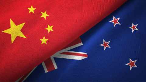 A Chinese flag and New Zealand flag.