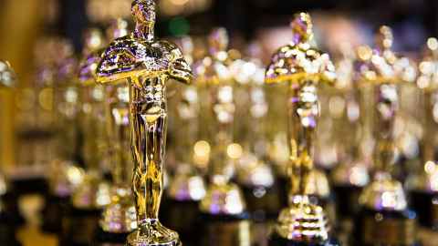 Oscar statues are pictured in a row: In more than 90 years of the Academy Awards, the Oscar for best original film score has only been won by a female composer three times. Photo: iStock 
