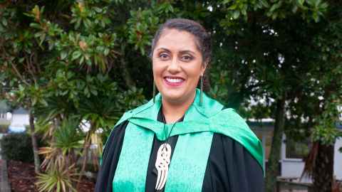 Maia Hetaraka wearing academic regalia