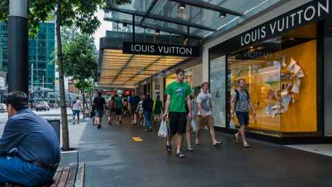 Shoppers are pictured walking past the Louis Vuitton store on Auckland's Queen Street: The luxury brand market recovered more quickly than mass appeal brands following the Global Financial Crisis. Photo: iStock