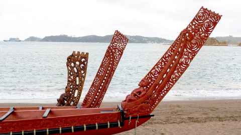 Three waka on a beach