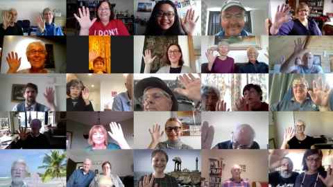 A Zoom meeting with 25 screens showing people waving a hand