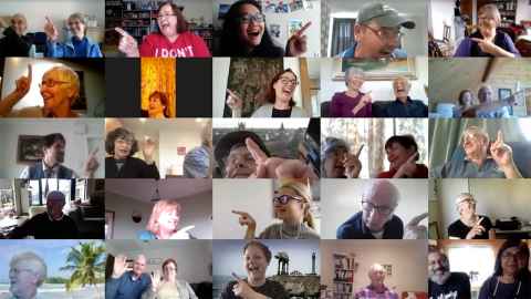 A Zoom meeting with 25 screens showing people appearing to point at and look at other screens