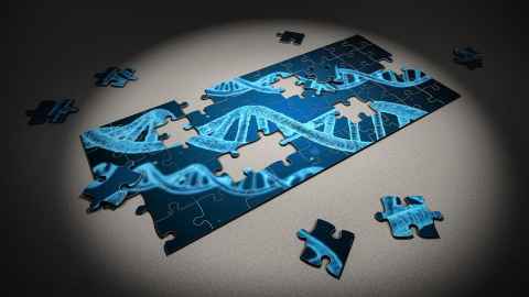 A jigsaw puzzle with an image of DNA strands
