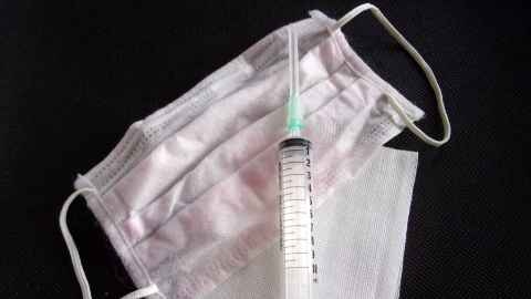 A syringe and a facemask