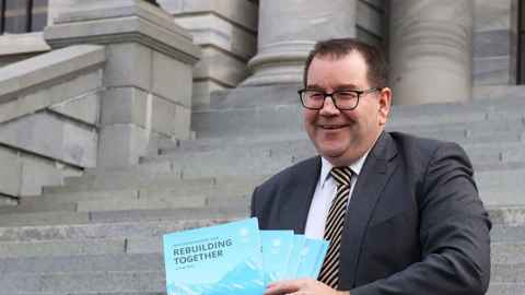 Finance Minister Grant Robertson is pictured on the steps of Parliament with this year's Budget. Photo: Lynn Grieveson