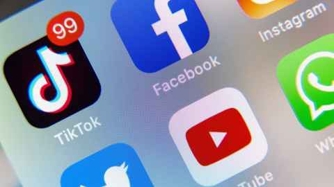 The image shows a TikTok icon on a mobile phone: The Trump administration has made moves to ban the Chinese-owned TikTok video-sharing platform over alleged data privacy practices. Photo: iStock