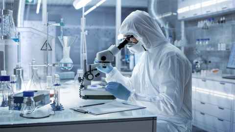 An image show a scientist dressed in protective clothing working in a laboratory: Scientists are doing their work and investing additional time  in explaining why armchair reckons are unreliable and misguided. Photo: iStock 