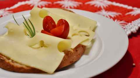 Slices of Swiss cheese on bread.