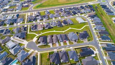 An aerial view of suburban houses.