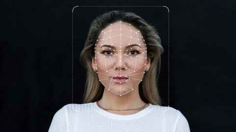 A face seen through facial recognition software, marked with lines and dots.