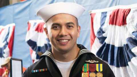 Jeffrey wearing a Navy uniform.