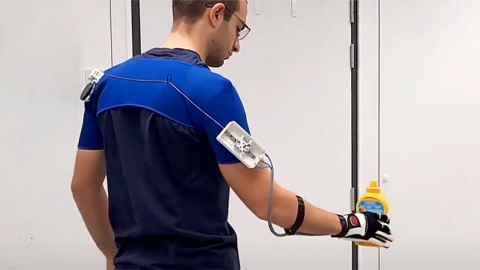 A man with a device attached to his arm.