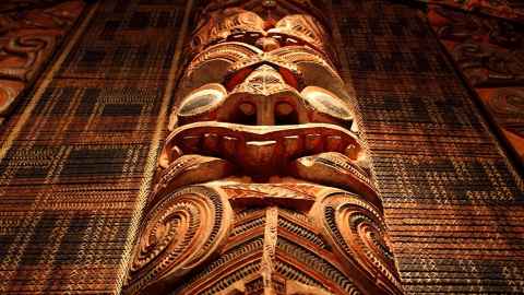The image shows an intricate Māori carving in a meeting house: The rich opportunities, strengths and values offered by Māori have been too long overlooked while the inequities suffered are renown. Photo: iStock