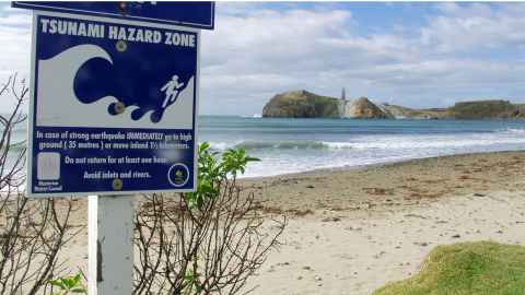 The image shows a Civil Defence warning sign at the beach in the Masterton district: Communities are all part of local Civil Defence and can help by being aware of local hazards and risks, and plan for possible emergencies. Photo: Courtesy of Civil Defence