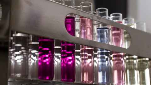 Test tube with different-coloured liquids.