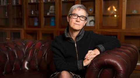 The image shows a head and shoulders photo of Professor Jane Kelsey
