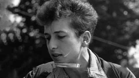 The image shows Bob Dylan in 1963. Photo: Rowland Scherman via Wikimedia Commons