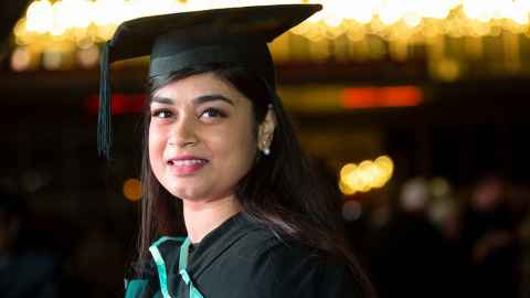 Divya Rathore in graduation regalia.