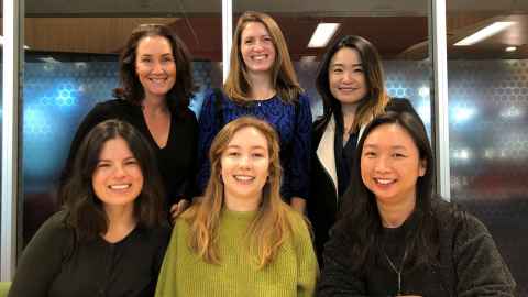 Six smiling women.