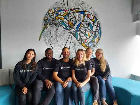 Six people with t-shirts with 'Easycrypto' on them.