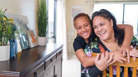A woman and child, laughing.