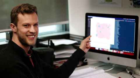 Charlie Ruffman, pointing at a screen.