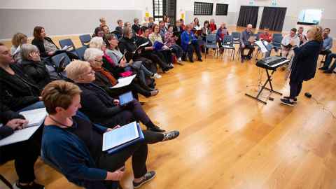 Kate Bell in action with a choir in West Auckland