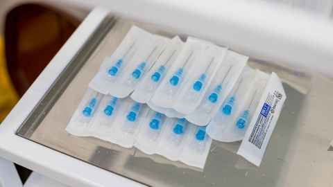 Syringes wrapped in plastic.