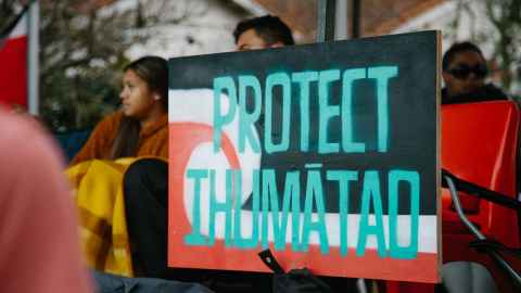 A sign that says: Protect Ihumātao.