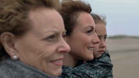 Two women, one older, one younger, and a child.
