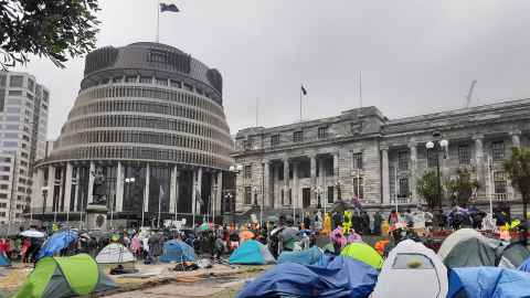 Tents pitched and people gathered outside the Beehive.