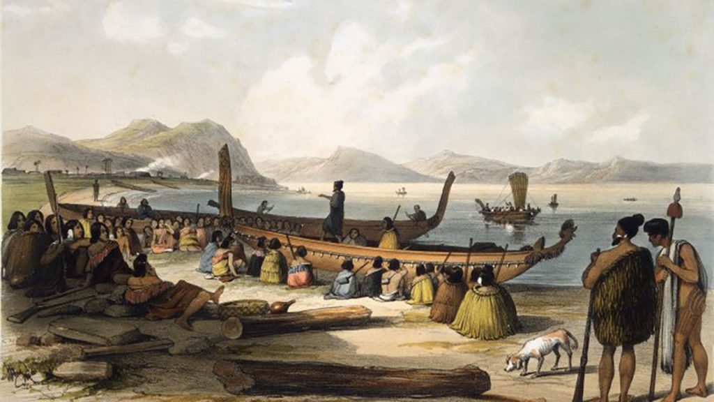 A black dog looking back at the camera.