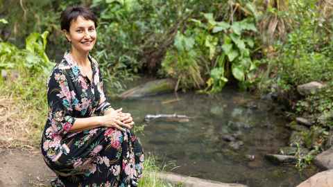 Billie sitting by a little stream