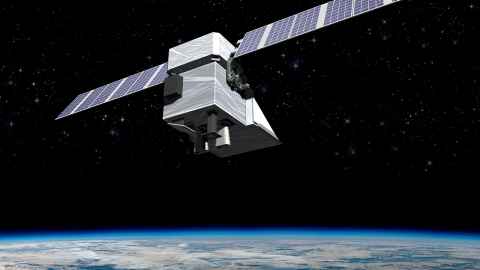 The image shows an satellite - a box-like metal structure with rectangular wings on either side - in orbit above the Earth which is shown in the bottom part of the image. Image: Ball Aerospace