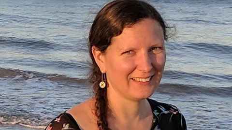 A woman on a beach.