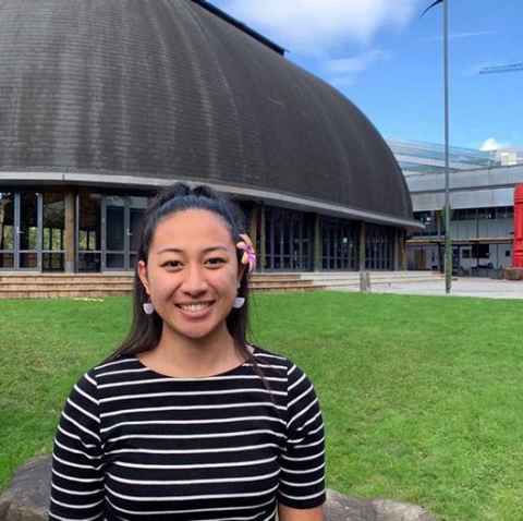 Hollyanna Ainea in front of the Fale Pasifika.