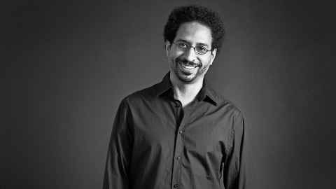 A black and white portrait of a man.