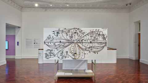A gallery with an artwork featuring cables.