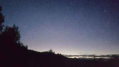 Stars against an almost completely dark sky.