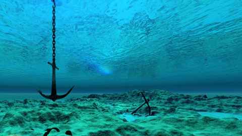 A seabed with an anchor being lowered down to it.